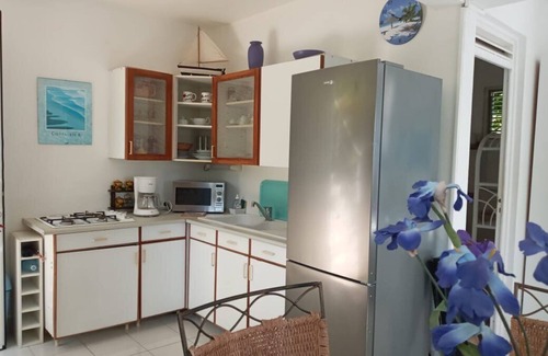 Les Abymes Apartment | Charming studio in a tropical garden. with swimming pool, free wifi and parking.