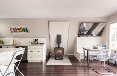 Grey Highlands Cabin | Charming updated A-frame home nestled in the woods adjacent to Kimberley Creek.