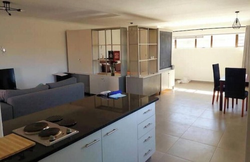Houghton Estate Apartment | Chic 1-bedroom with WiFi and fitness room in vibrant Johannesburg