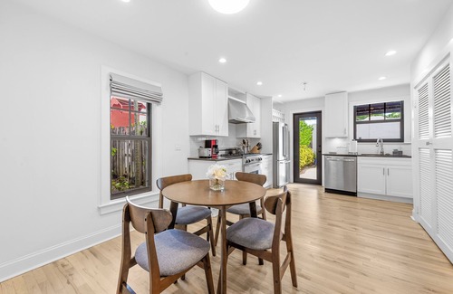 Old Northwood House | Chic 4BR retreat with private pool and modern amenities. Detached guest house includes queen bed, full bath, and kitchen. Minutes from downtown West Palm Beach, Palm Beach Island, Northwood Village, and Palm Beach Outlets.