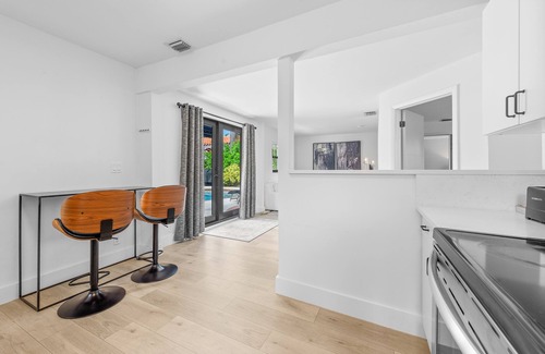 Old Northwood House | Chic 4BR retreat with private pool and modern amenities. Detached guest house includes queen bed, full bath, and kitchen. Minutes from downtown West Palm Beach, Palm Beach Island, Northwood Village, and Palm Beach Outlets.