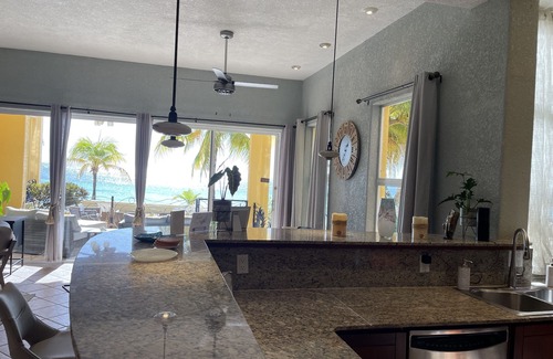 West Bay Condo | Chic condo steps away from the ocean on west bay beach!