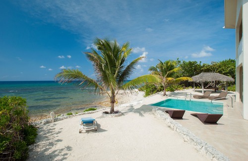 Old Man Bay House | Christmas Palms: Serene Villa with an Oceanfront Pool and Private Beach