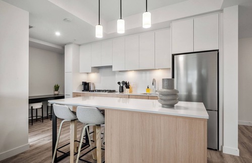 Eau Claire Apartment | City Sophistication w 2 BR River View, Parking, Office