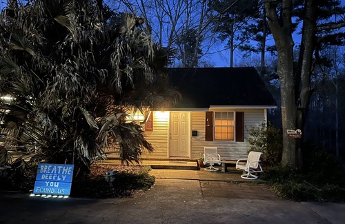 Dothan Apartment | Claire’s Cottage is located on 7 secluded acres with a coded privacy gate.