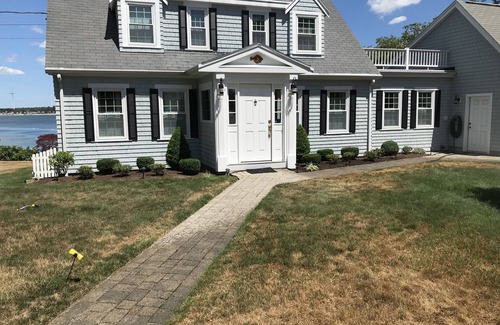 Buzzards Bay House | Classic cape on a hill over looking buttermilk bay
