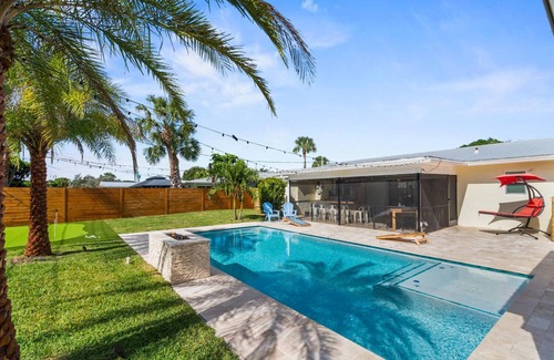 Hunt Club House | Clean Florida Coastal Design home with Heated Pool, Fireplace and Putt Putt
