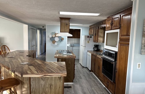 Garden City Cottage | Coastal cottage minutes from the beach. Large front porch for morning sun!