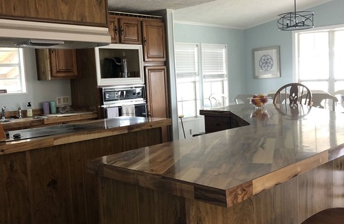 Garden City Cottage | Coastal cottage minutes from the beach. Large front porch for morning sun!