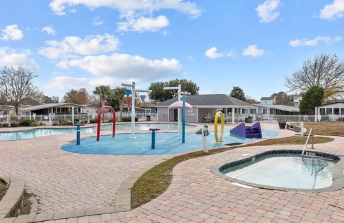 Garden City Cottage | Coastal cottage minutes from the beach. Large front porch for morning sun!