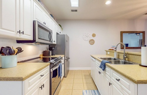 Sea Trail Condo | Coastal Villa with golf course view and shared pool access