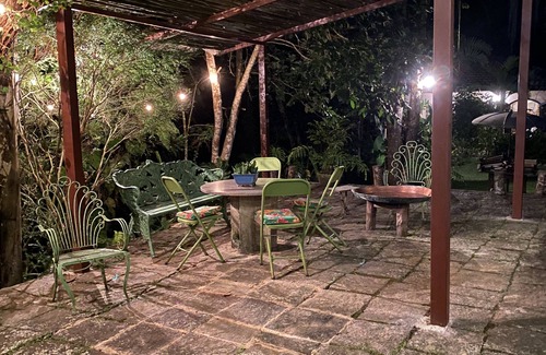 Correas House | Colonial house with a smaller house on the edge of a river and along the forest.
