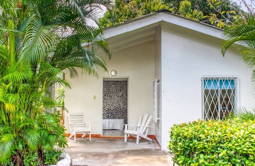 Puntarenas Cottage | Colorful getaway w/ shared pool/gardens & a great beachfront location!