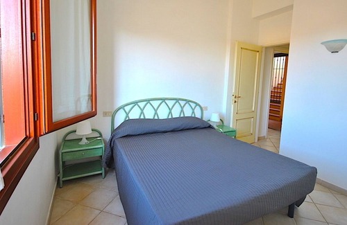 Porto San Paolo House | COMFORTABLE APARTMENT WITH VERANDA 500 METERS FROM THE BEACH 50 METERS FROM THE SERVICES