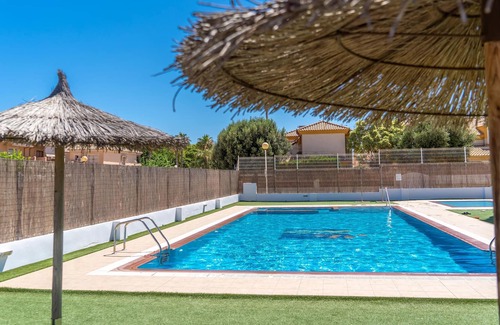 Santiago de la Ribera Apartment | Comfortable apartment with shared pool near the beach.