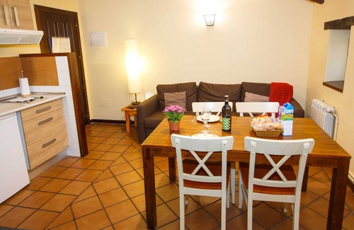 Robregordo Ski Chalet | Comfortable bedroom apartment sofa bed and fireplace on the first floor