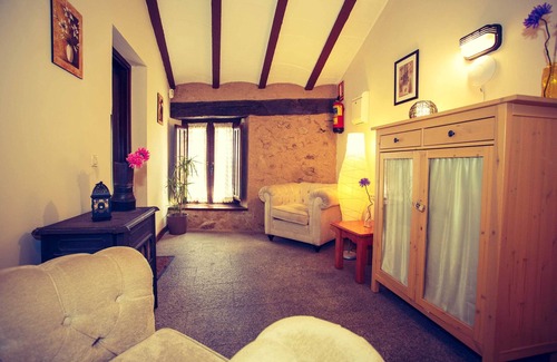 Robregordo Ski Chalet | Comfortable bedroom apartment sofa bed and fireplace on the first floor