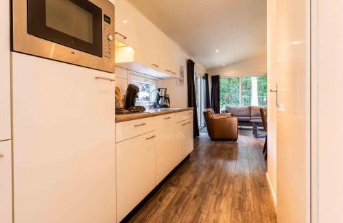 Ede Ski Chalet | Comfortable chalet with dishwasher within De Veluwe