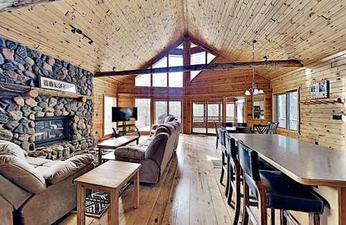 Hayward Cabin | Comfortable lake home with sandy beach and private dock on LCO Lake
