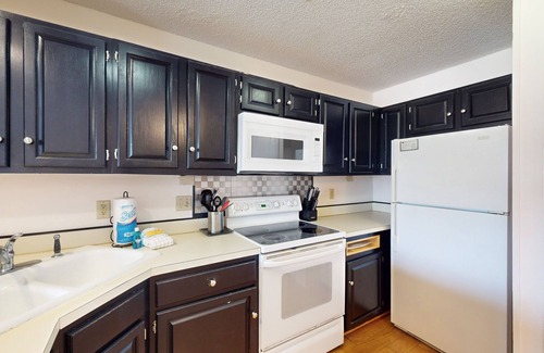 East End House | Comfortable townhome steps from beach with pool access, balcony, & W/D
