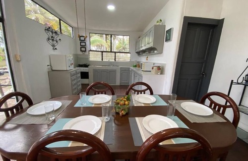 Mompiche House | Comfortable villa between palm trees facing the sea.