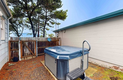 Newport House | Comfy duplex with peekaboo ocean views, private hot tub, & easy beach access