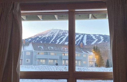 Carrabassett Valley Apartment | Comfy ski-in and out Sugarloaf 2-bedroom condo with access to pool house