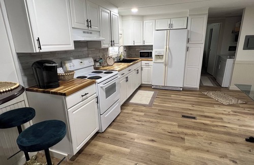 Moultrie House | Completely renovated mobile home sitting own a pond.