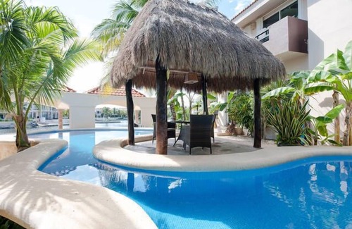 Puerto Aventuras Condo | Condo Bellmare Luxury front of lagon 4 step to the priv Pool 1 min to the Beach