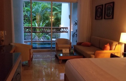 Villa Juarez Resort | Condo, with Jacuzzi and mini pool at porch. A beach nearby with lot of amenities