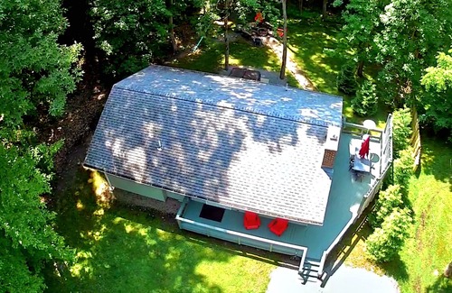 Conneaut Lakeshore Cottage | Conneaut Getaway - with hot tub and rustic fire pit