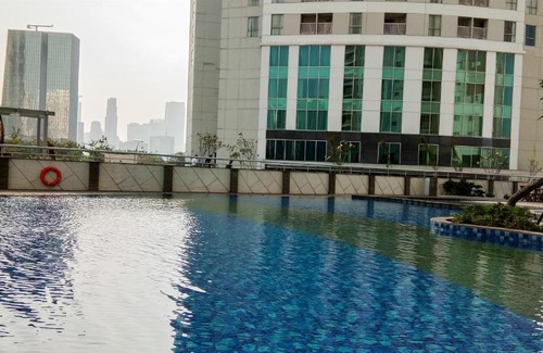 Karet Apartment | Contemporary 2BR at The Wave Apartment By Travelio