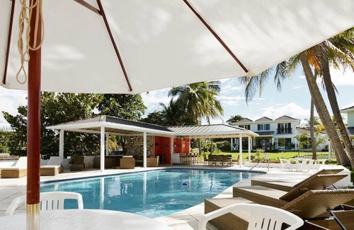 Tower Isle Villa | Coral Cay Villa Beachfront Retreat Pool, Panoramic Ocean Views & Modern Design