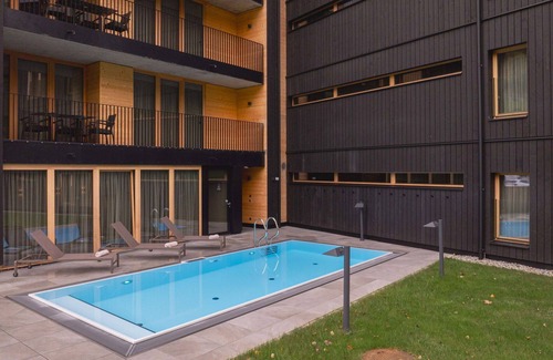 Schruns Apartment | Cosy apartment for 6 guests with pool, WIFI, TV, balcony and parking
