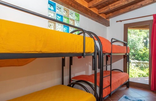 Telti Apartment | Cosy apartment for 8 people with A/C, WIFI, pool, TV, patio, pets allowed and parking