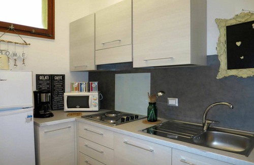 Brezzo di Bedero Apartment | Cosy apartment for 4 people with pool, WIFI, TV, patio and pets allowed