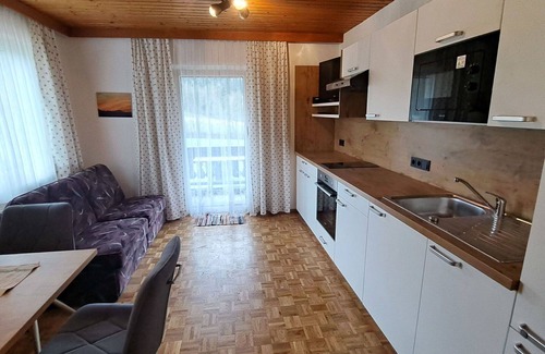 Oberwang Villa | Cosy apartment in villa for 4 guests with WIFI, TV and balcony