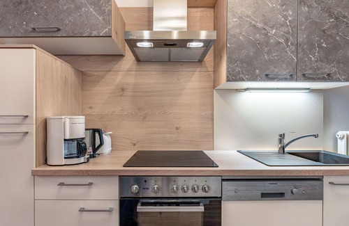 Arriach Villa | Cosy apartment in villa for 9 people with WIFI, TV and patio
