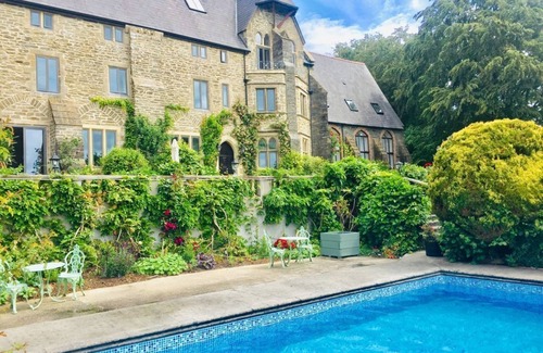 Lostwithiel Cottage | Cosy chapel cottage at Peregrine Hall with pool and walking distance into town
