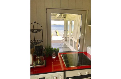 Bjert House | Cottage on grassy plot with panoramic views of the water and outdoor Jacuzzi
