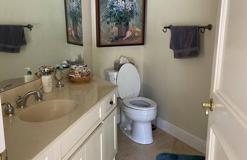 Hunt Club Bed & Breakfast | Country Garden Room with Water Garden feature and Queen Bed.
