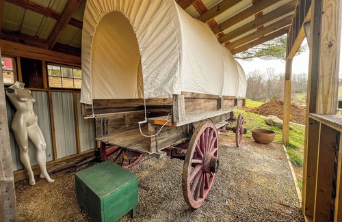 Floyd RV Rental | Covered Wagon Overlooking Pond