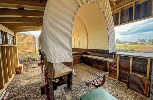 Floyd RV Rental | Covered Wagon Overlooking Pond