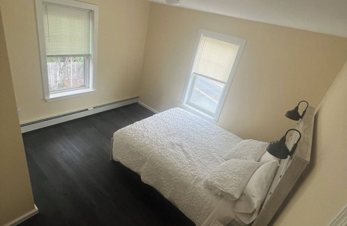 Guild Apartment | Cozy 2-bedroom apt-1 in Lakes Region with AC, WiFi, Pet friendly 2 queen beds