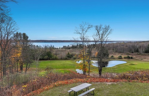Kewadin Condo | Cozy 3-bedroom condo overing looking Torch Lake on the A-Ga-Ming Golf Course
