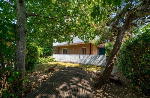 Grado Pineta Apartment | Cozy 56 sqm ground-floor apartment featuring a balcony running along the entire perimeter and a private garden, perfect for relaxation and tranquility. Located in Grado Pineta, a green and quiet area just steps from the sea and nature trails, it offers t