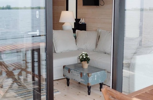 Plaue Boat Rental | Cozy and romantic houseboat in a prime location with fireplace and sauna.