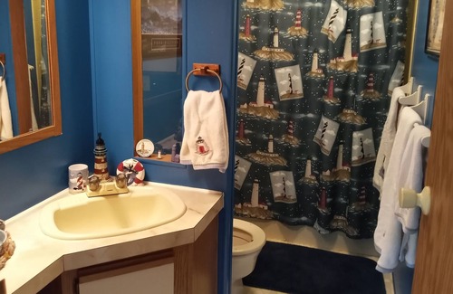 Manistique House | Cozy accommodations on Indian Lake with small sand beach.