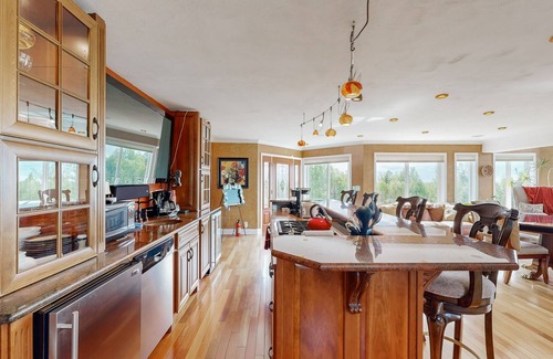Mid-Hillside Apartment | Cozy apartment with large deck with views, hot tub & wood stove