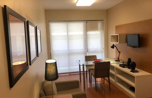 Leblon Apartment | Cozy bedroom and living room with balcony in Leblon.